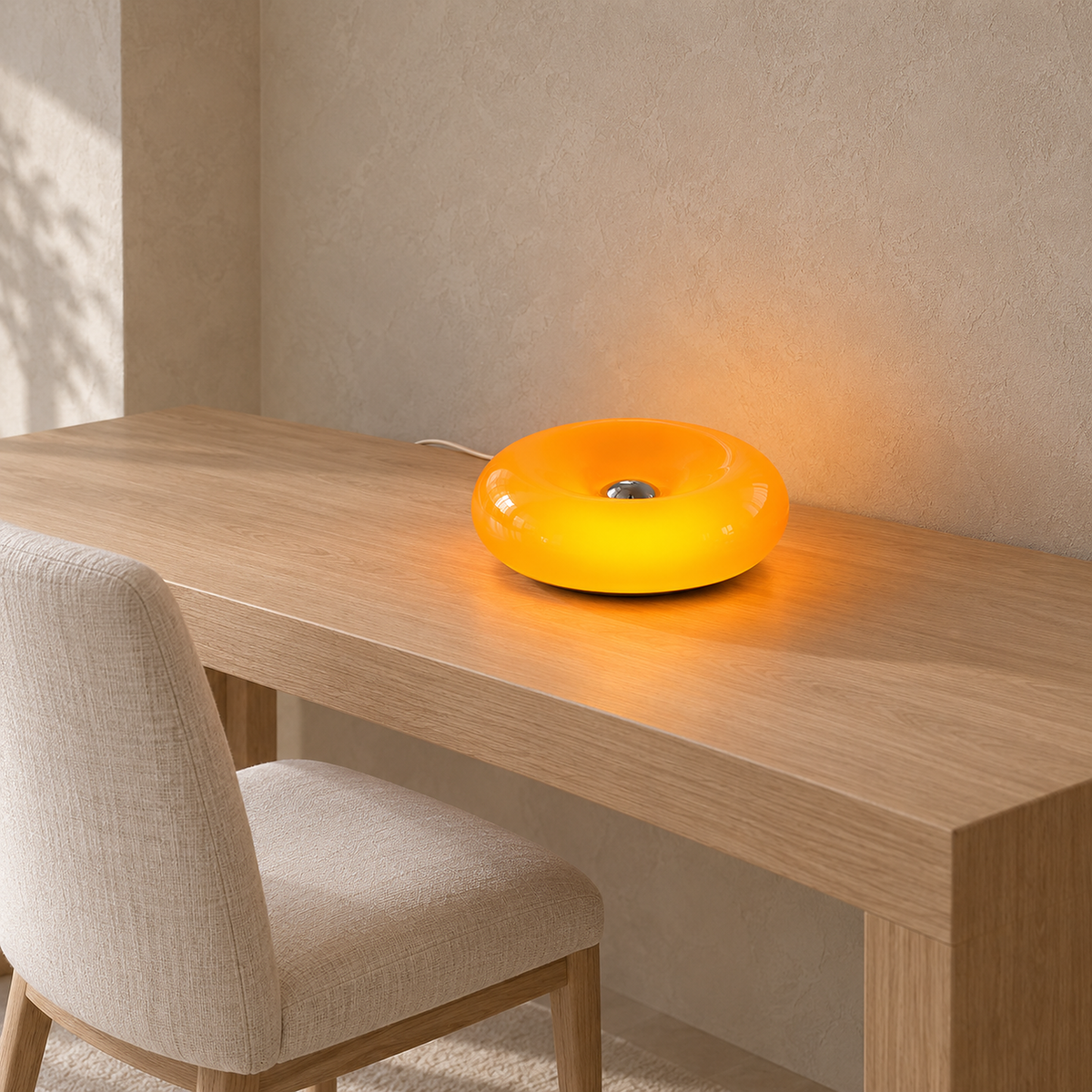 Siravel orange plug in wall sconce glowing as it rests horizontally on a dining room console in daylight