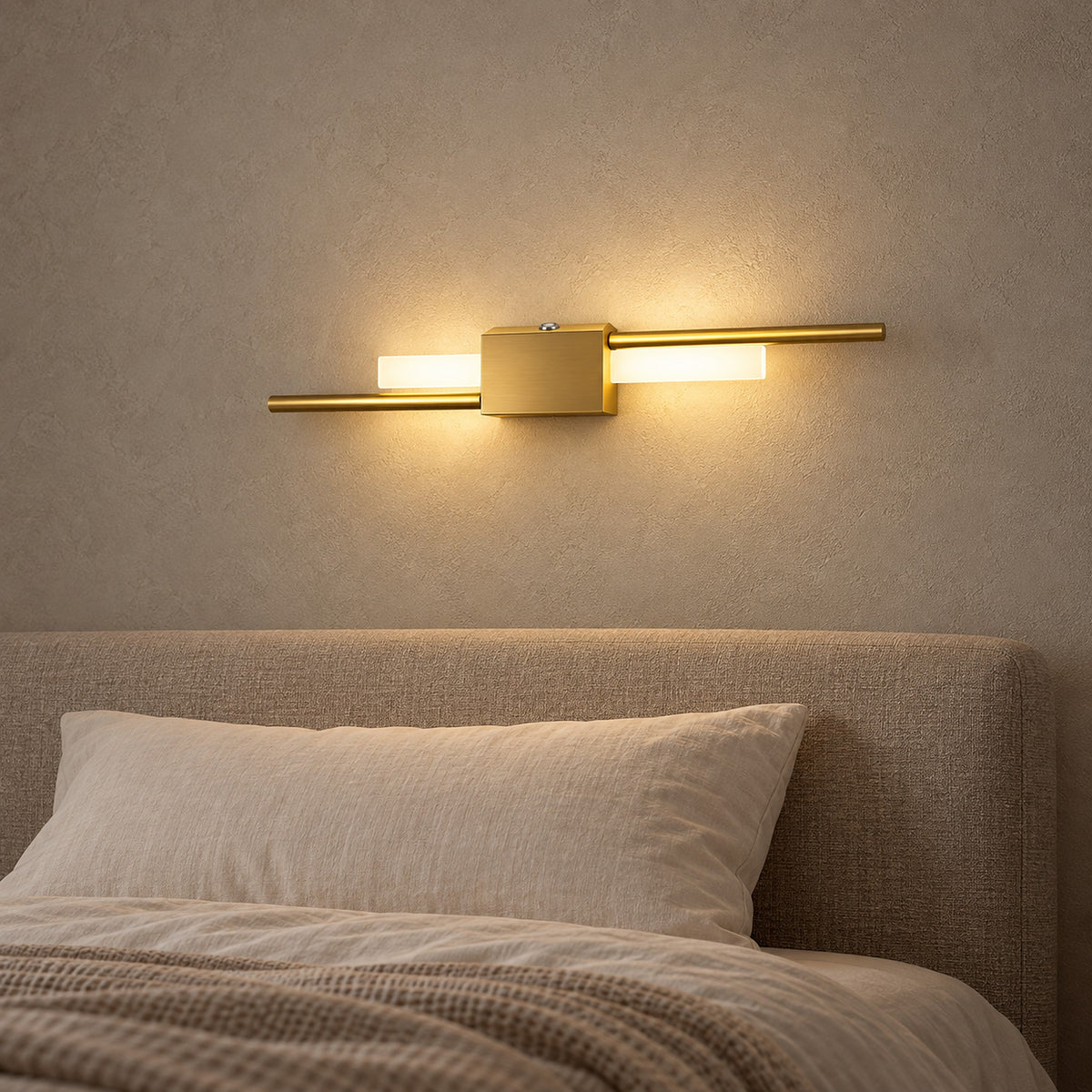 Sorlimo gold and white bedside wall light mounted horizontally on a bedroom wall