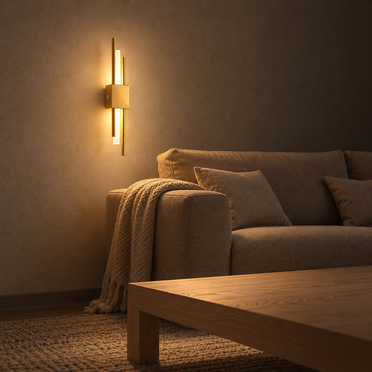 Sorlimo gold and white cordless wall lamp glowing warm beside a living room sofa at night