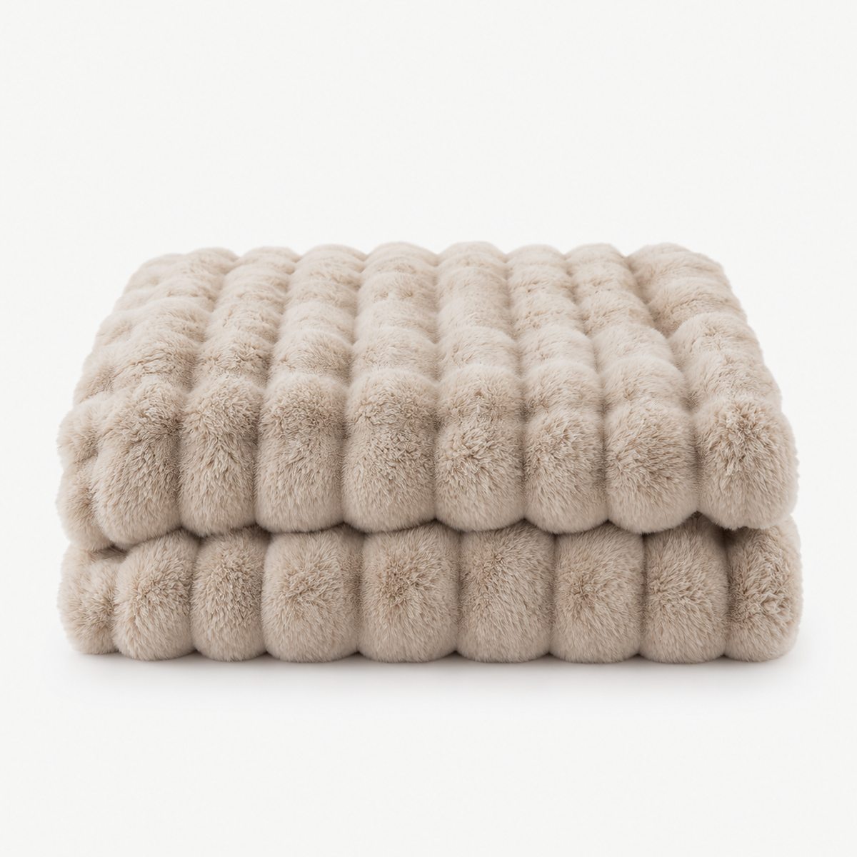 Sorvila beige coral fleece throw blanket in loose folds showing its raised bubble texture