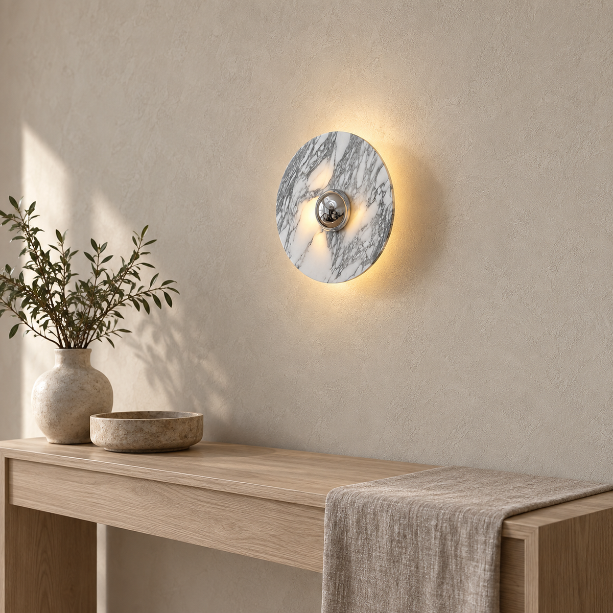 Talemio chrome LED wall sconce lit with clear plaster beneath it and no cord showing