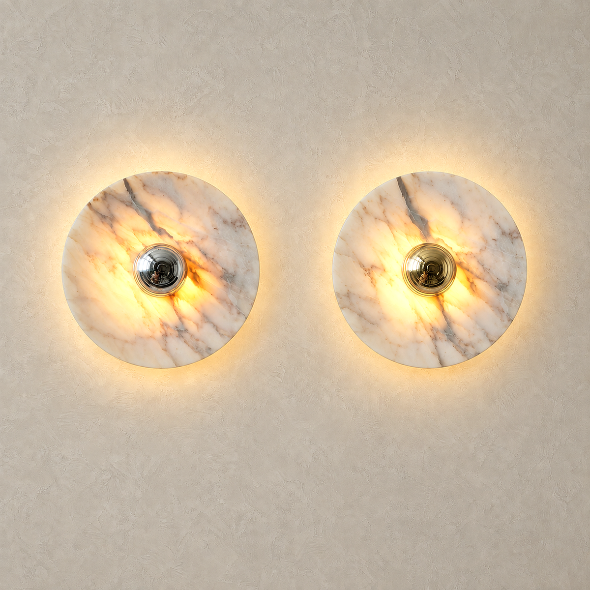 Talemio marble wall sconces in chrome and gold lit side by side for comparison