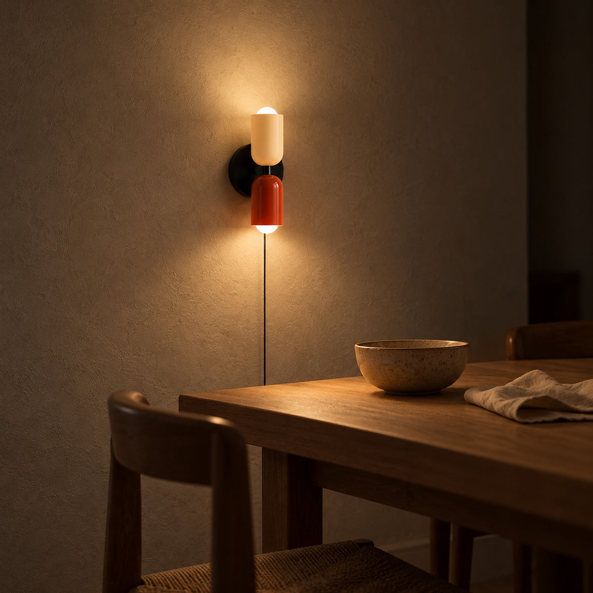 Talomi beige and red plug in wall light glowing in an evening dining corner #color_beige & red