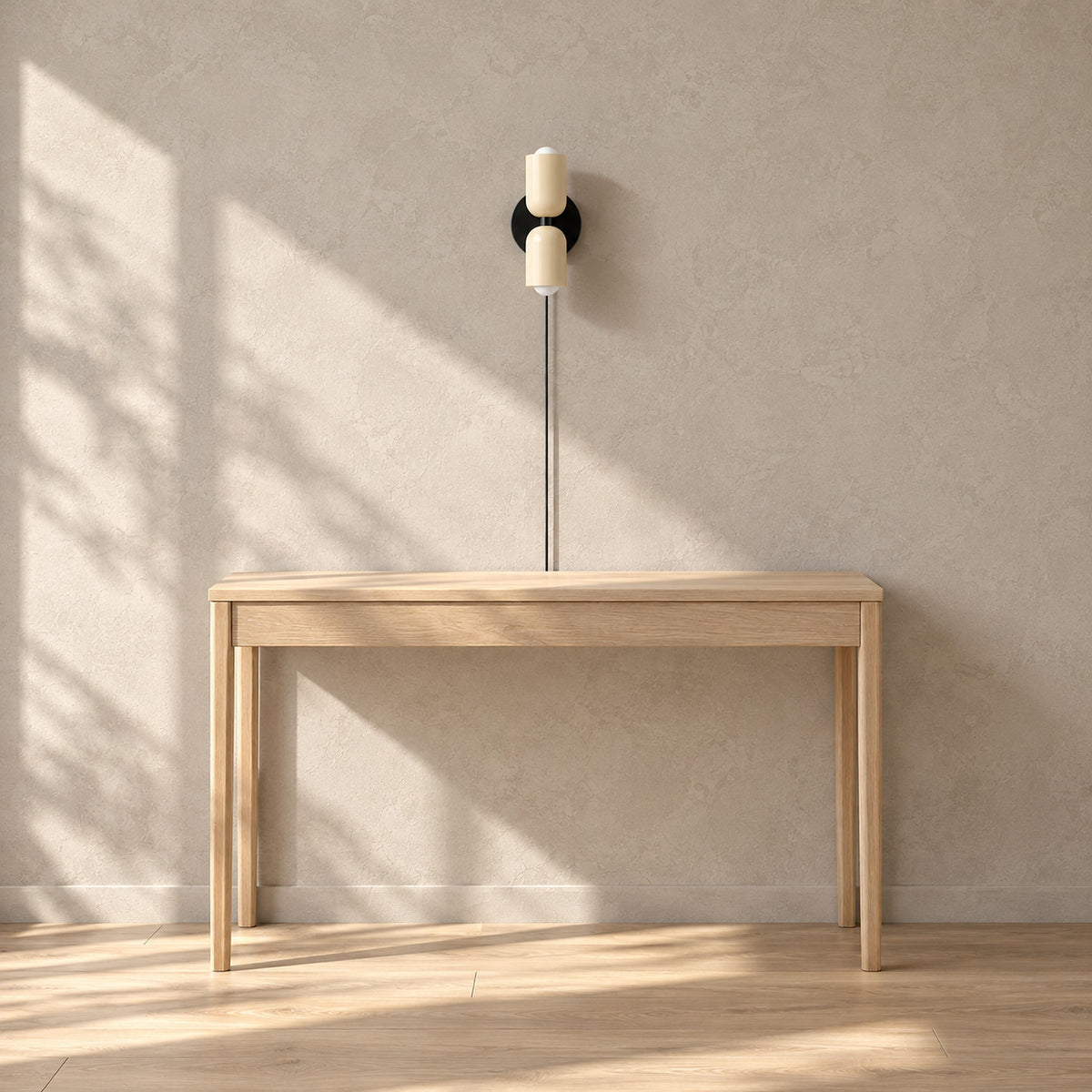 Talomi beige plug in wall lamp unlit above a pale console in a sunny entryway