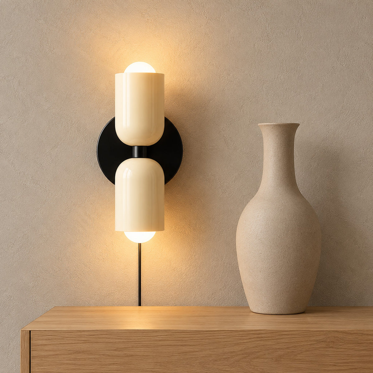 Talomi beige wall sconce glowing beside a vase above a dining room sideboard in daylight
