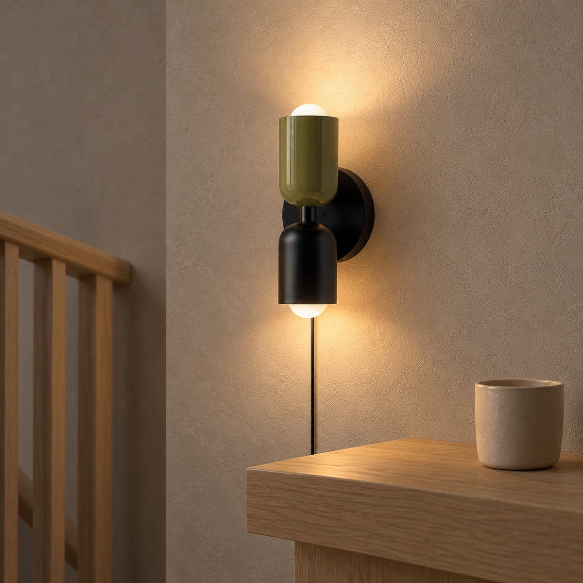 Talomi green and black plug in wall light warming a stair landing ledge #color_green & black