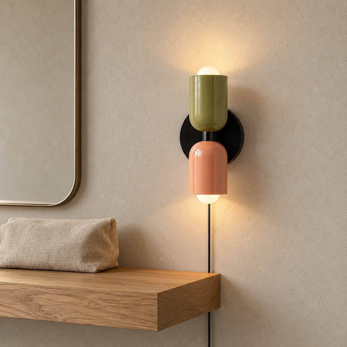 Talomi green and pink bedside wall light glowing beside a dressing room mirror #color_green & pink