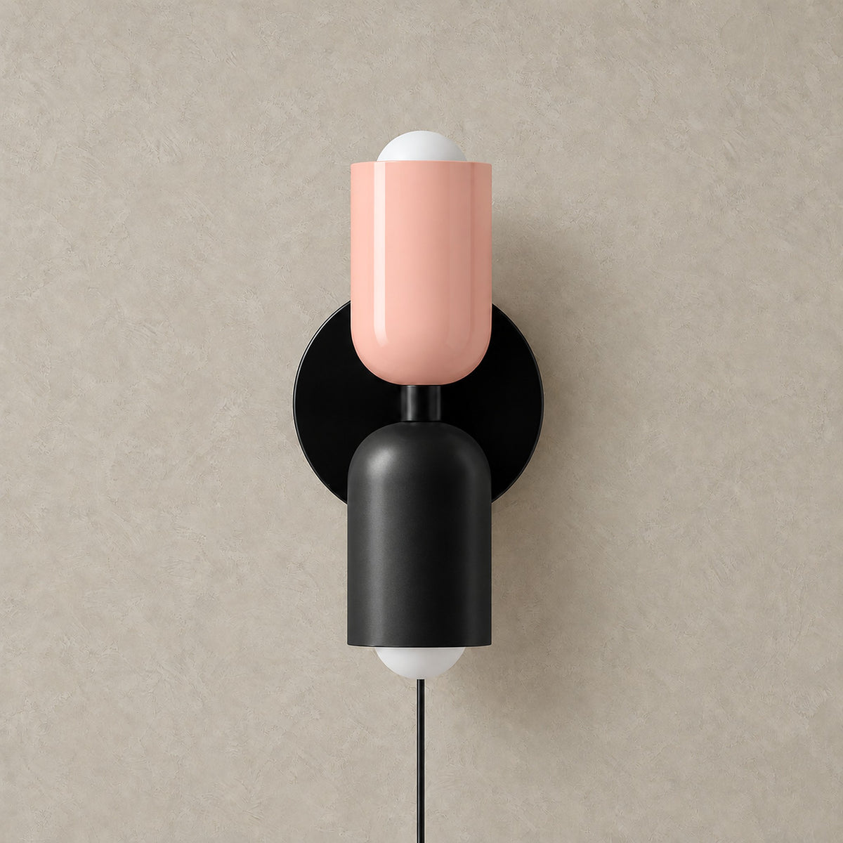 Talomi pink and black plug in wall light unlit on a plain backdrop showing its finish #color_pink & black
