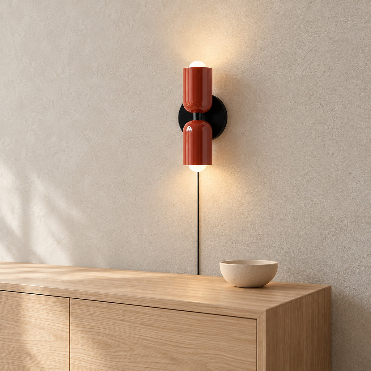 Talomi red wall sconce glowing above the corner of a dining sideboard #color_red