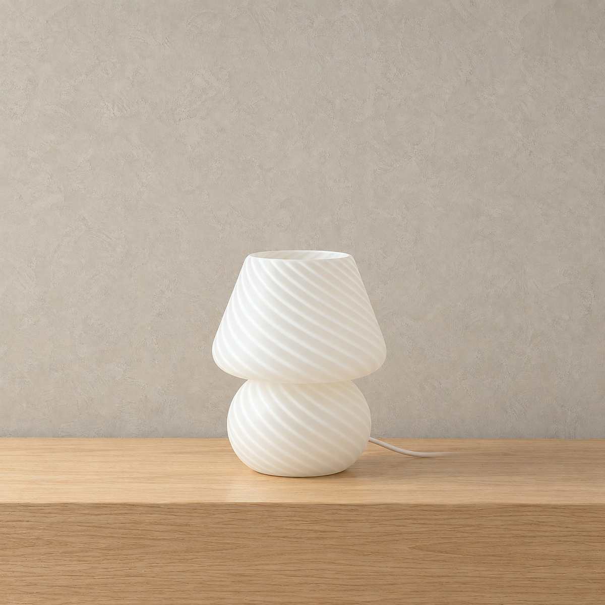 Talvire striped white glass mushroom table lamp switched off, swirling stripes across the glass shade and body