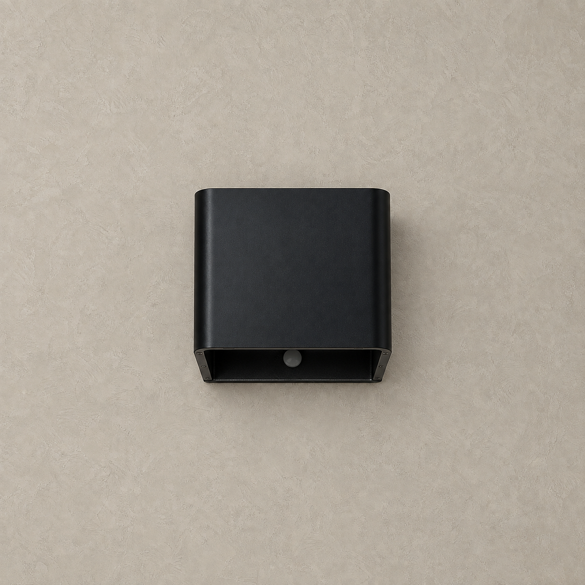 Tanelia black rechargeable wall sconce unlit on a warm greige plaster wall