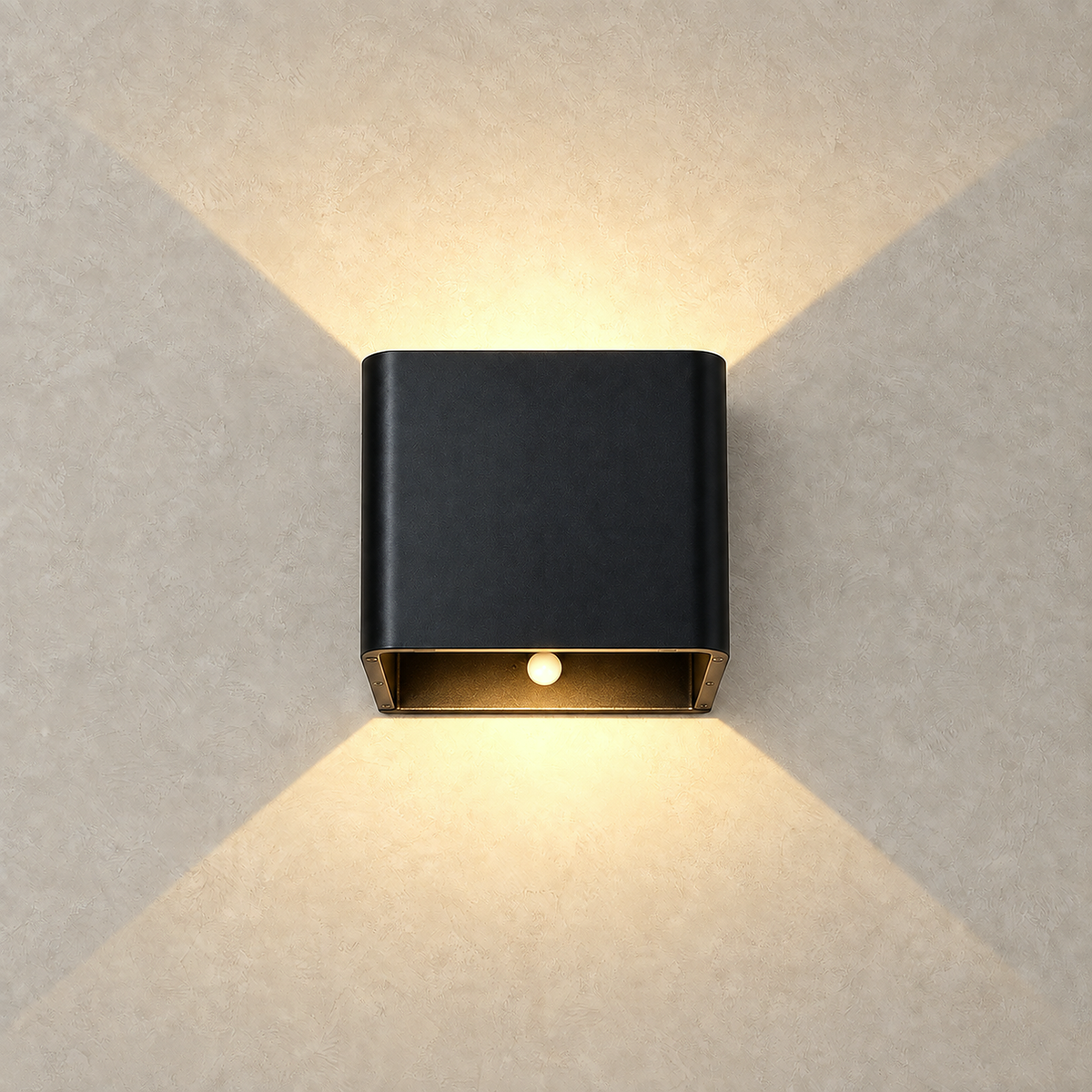Tanelia black LED wall sconce casting warm upward and downward light fans
