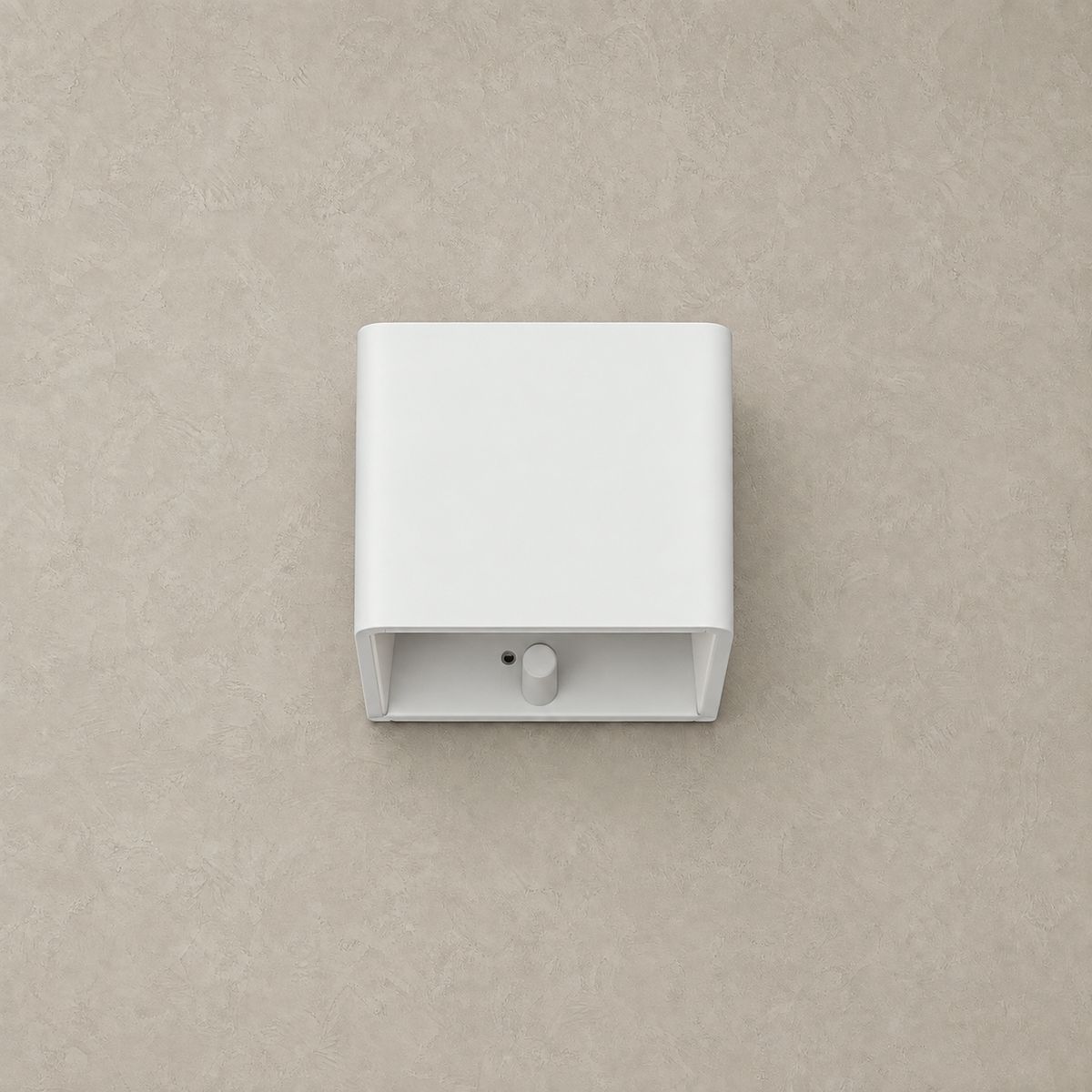Tanelia white rechargeable wall sconce unlit against a warm greige plaster background #color_white