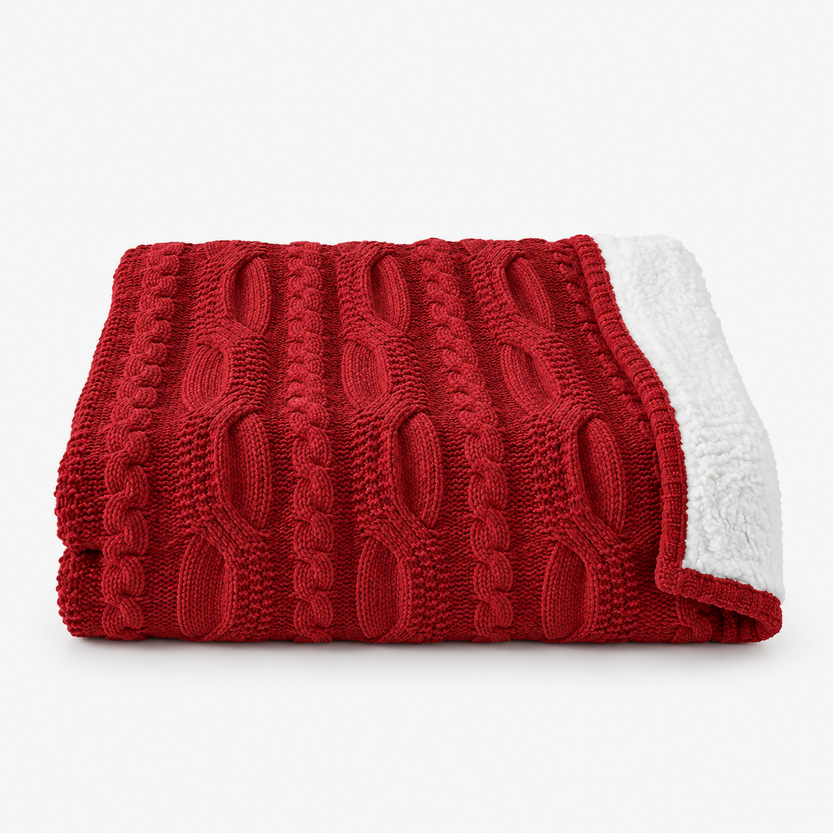 Tarivel red sherpa knit throw blanket loosely folded on white, cable knit chenille front with sherpa reverse