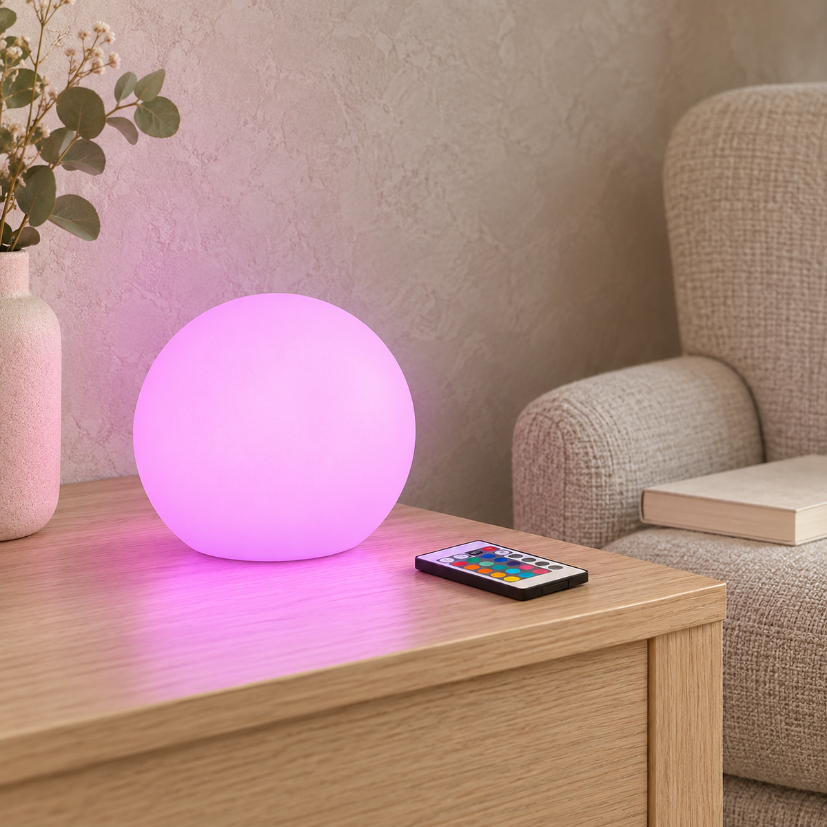 Tarmela white table lamp glowing pink in a quiet library corner by day