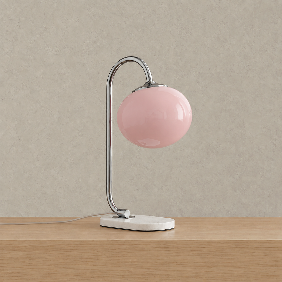Taselvo chrome and pink plug in table lamp, unlit, showing its finish on a plain backdrop #color_chrome & pink