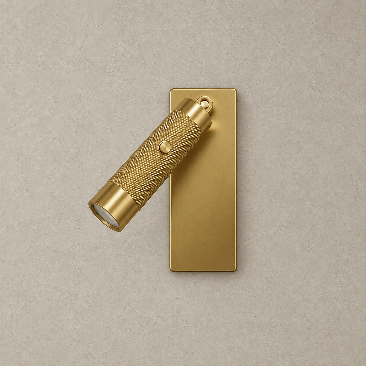 Tavelo gold LED wall sconce unlit against a plain plaster wall
