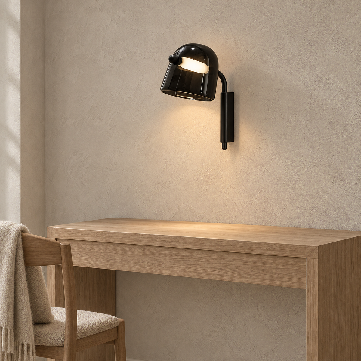 Tavessi black LED wall sconce lighting a console without taking up its surface