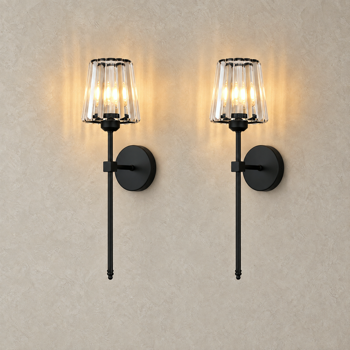 Tavirelo black rechargeable wall sconce shown as a lit set of two on plain plaster