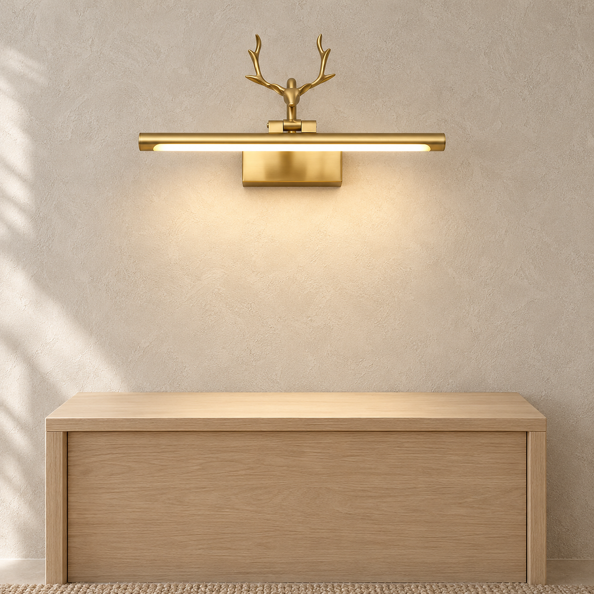 Tavorni gold plug in wall sconce lit above an empty entryway console in daylight