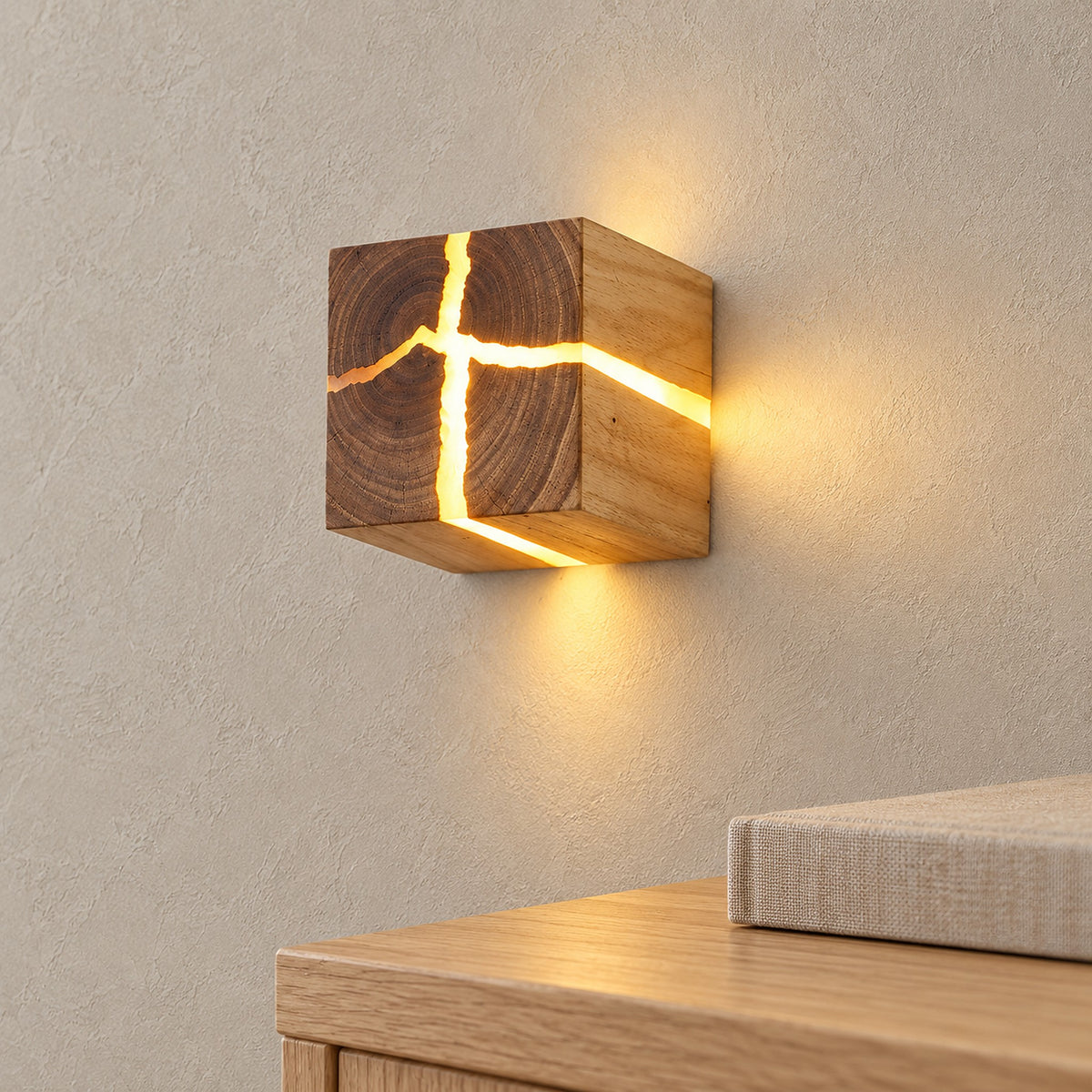 Temalio natural wood wall light with a glowing crack running onto its side beside an adult hand