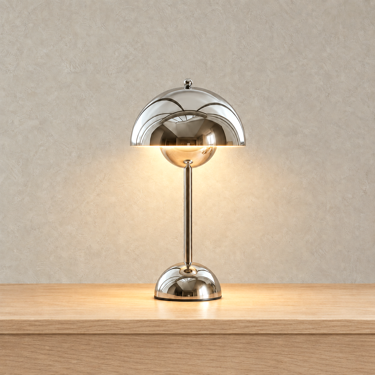 Temalor silver bedside lamp casting warm light downward from beneath its dome