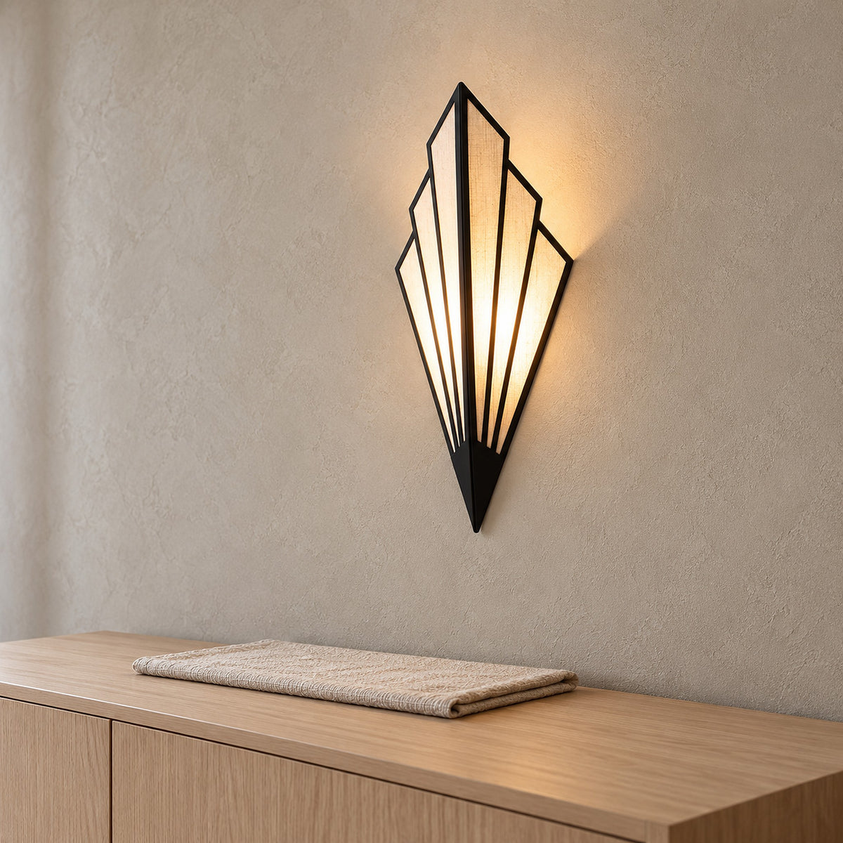 Ticorena black wall lamp seen from the side, showing the center ridge that steps out from the wall
