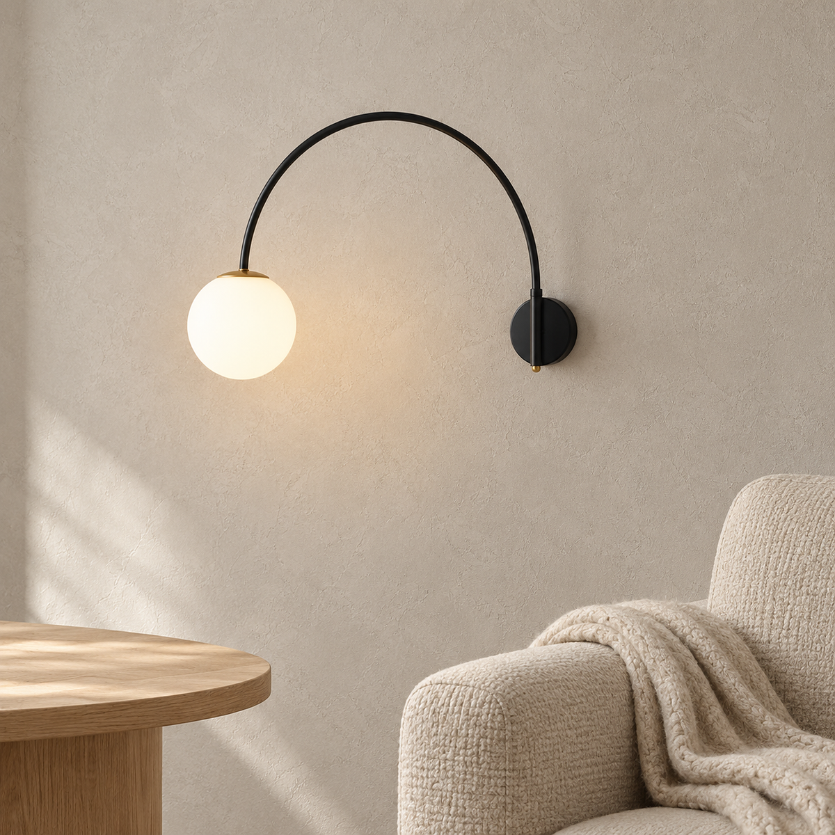 Tirsalo black and white wall light with adjustable arm swung left in a reading corner