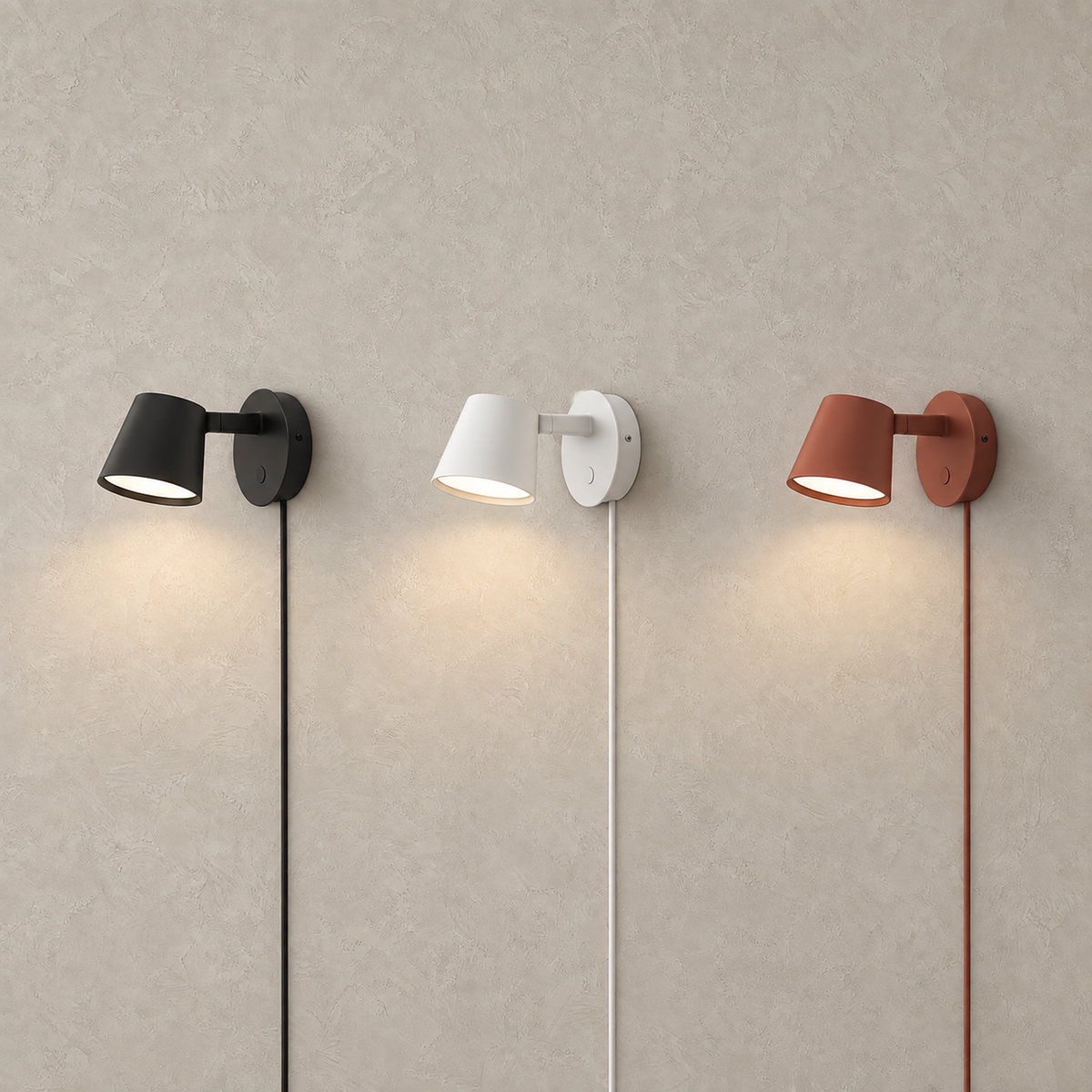 Tisello adjustable wall sconces in black, white and red lit side by side