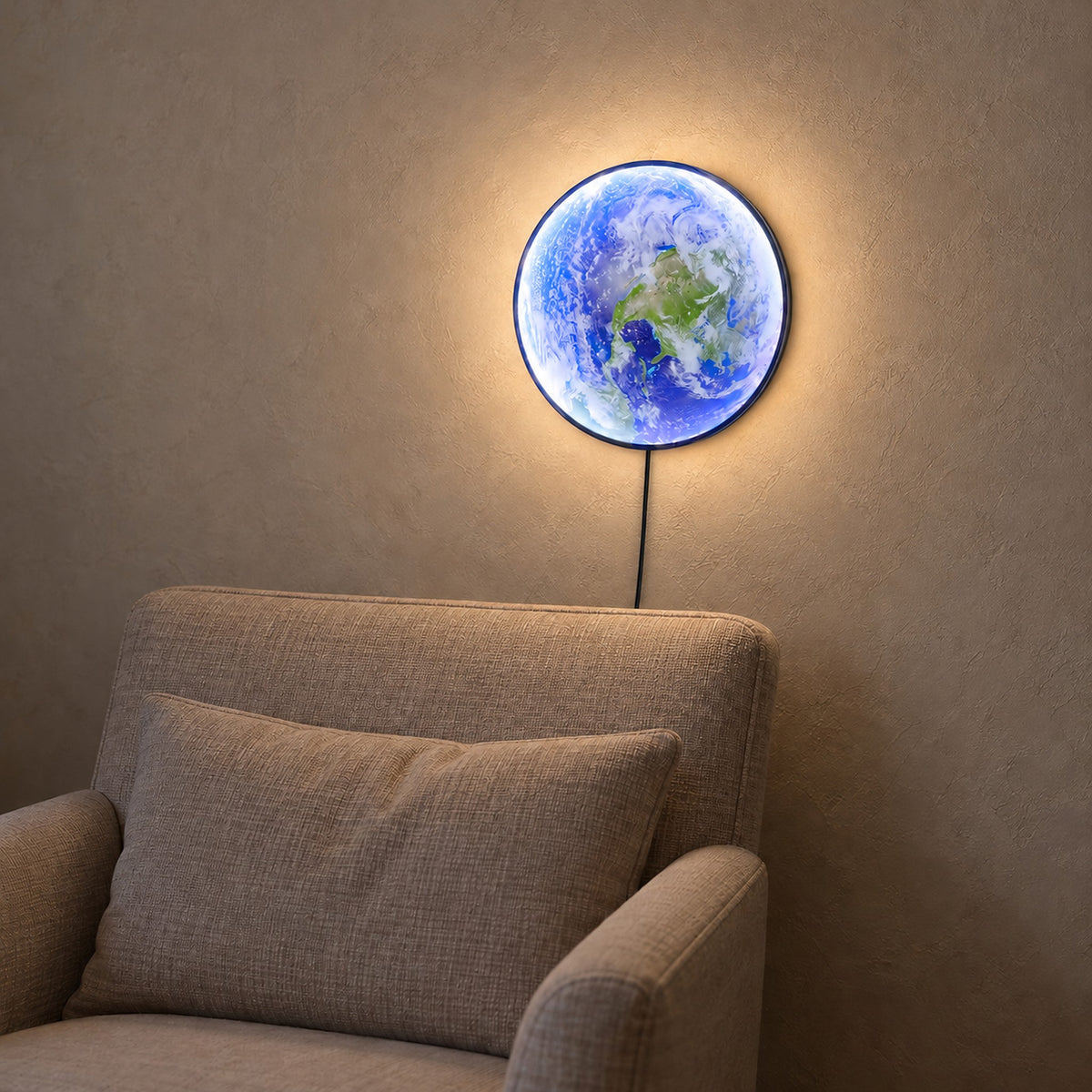 Tolanvi earth wall light in blue earth and dark rim, a wall lamp glowing with blue oceans, green land and white clouds