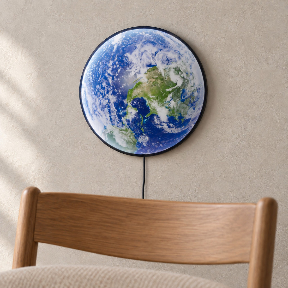Tolanvi earth wall light in blue earth and dark rim, a wall sconce seen up close with its unlit face and narrow rim