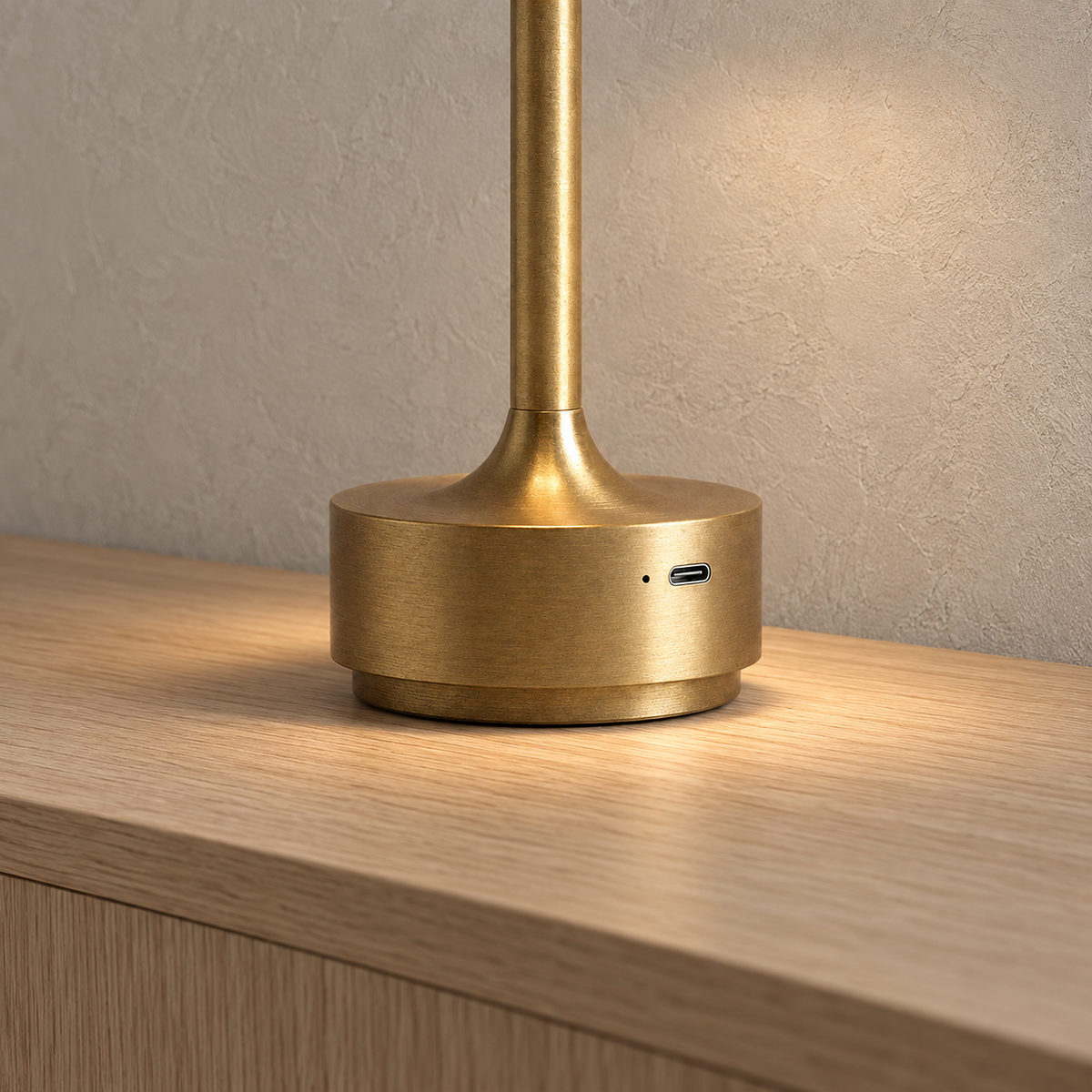 Tolimera gold battery operated table lamp with its USB charging port in an entryway #color_gold