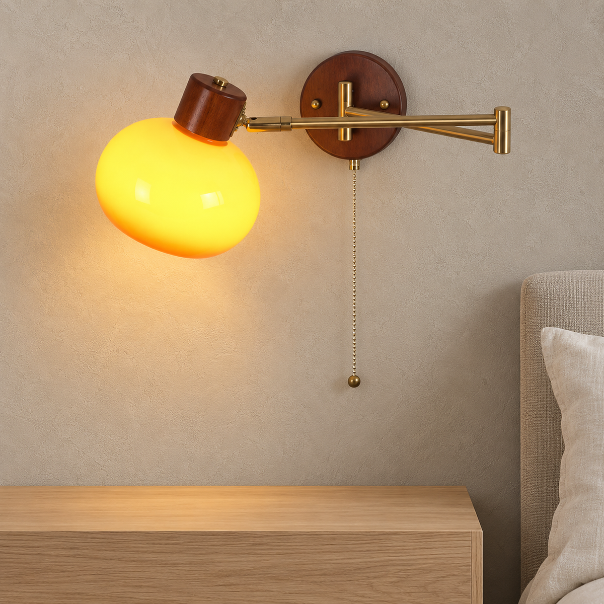 Tolvaren amber bedside wall light glowing above a nightstand in a guest room