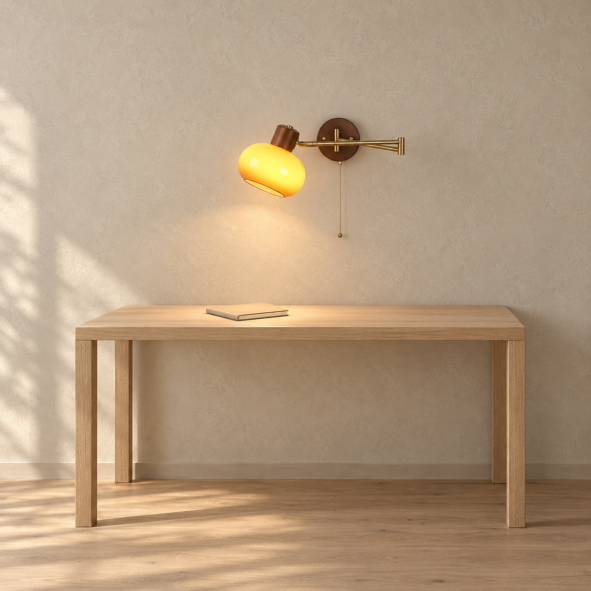 Tolvaren amber plug in wall lamp glowing above a desk in a home study
