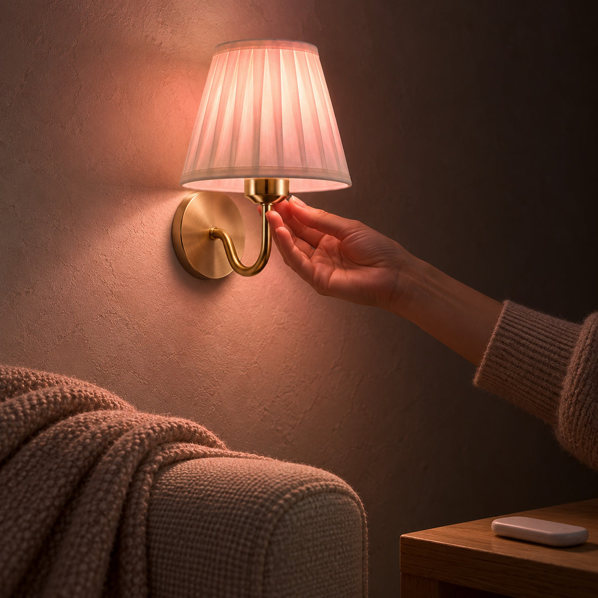 Tomirel gold cordless wall lamp set to a rose RGB glow beside the sofa in a reading snug at night