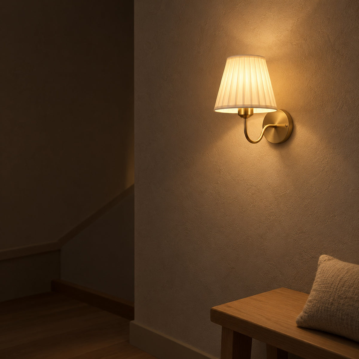 Tomirel gold wireless wall light warming a stair landing at night with light spilling onto the wall