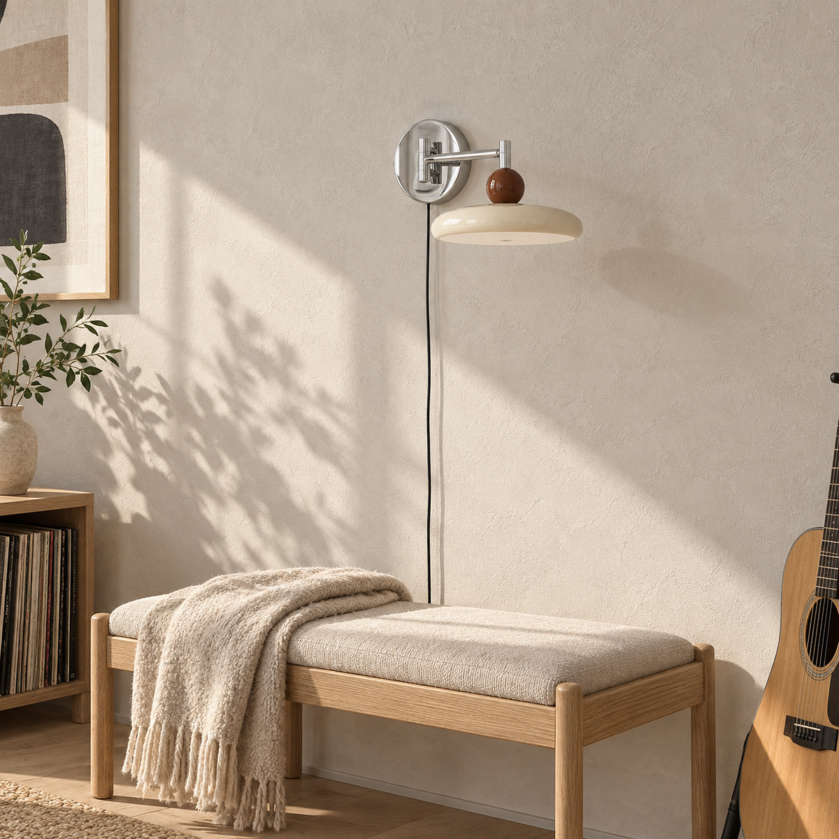Tovessi beige swing arm wall lamp folded inward and unlit on a music room wall in sunlight