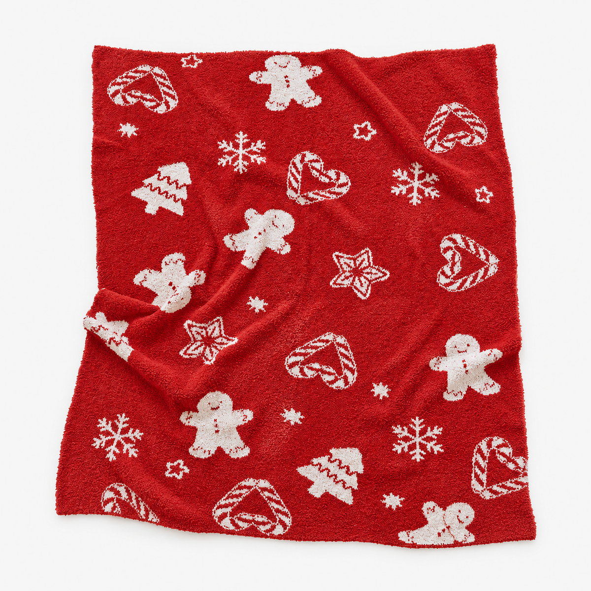 Vamelino xmas tree snowflake christmas knit throw blanket in red, laid open to show the whole jacquard pattern