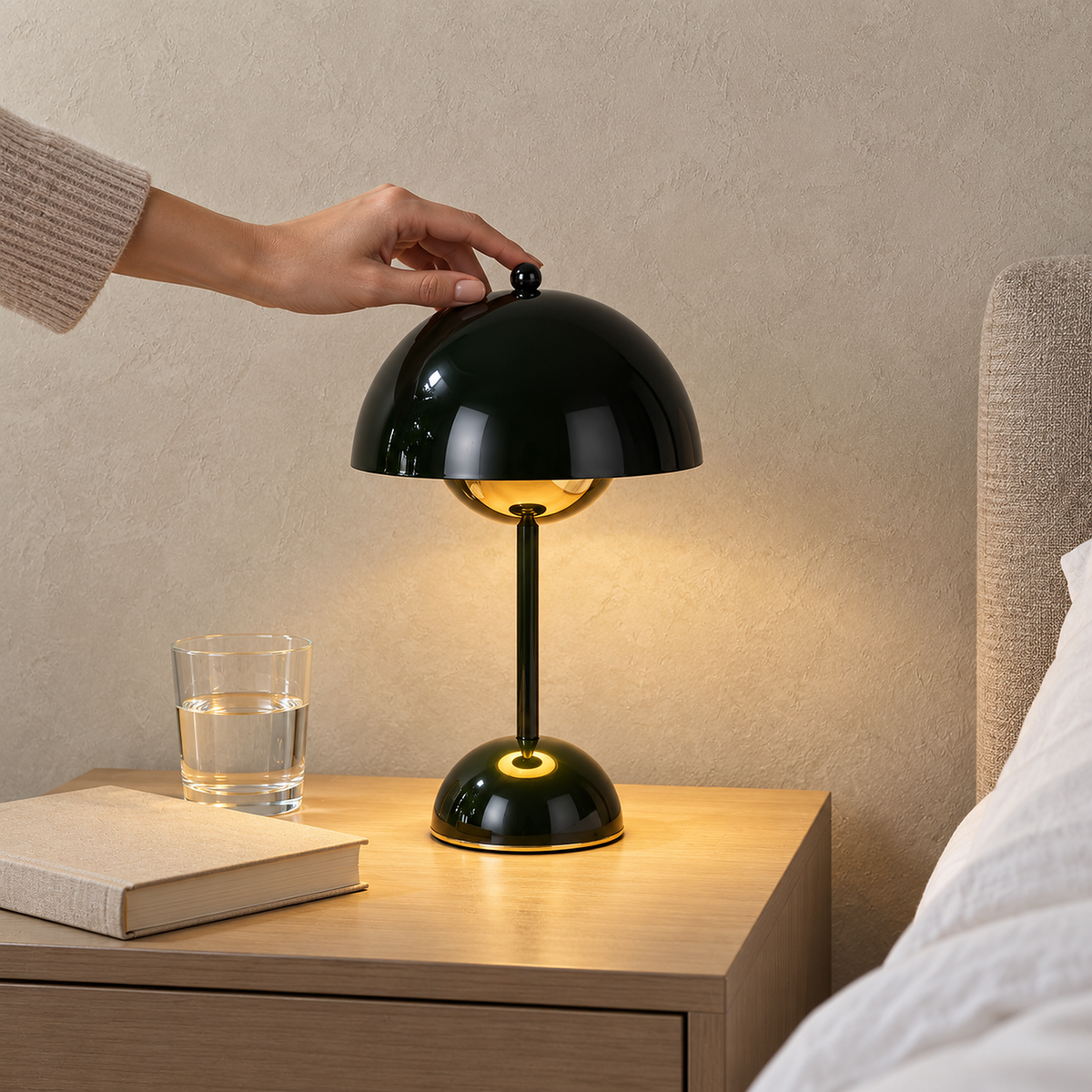 Varimel black battery operated table lamp sharing a small guest bedroom nightstand with essentials