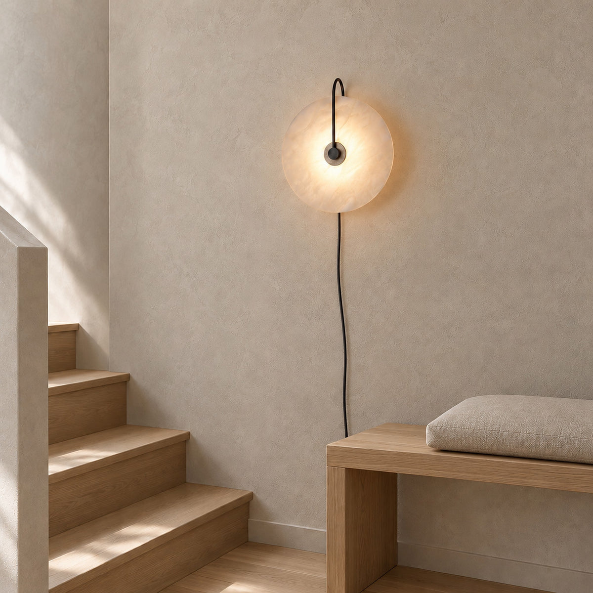 Velirsa black wall light glowing beside a bench on the stair landing in daylight