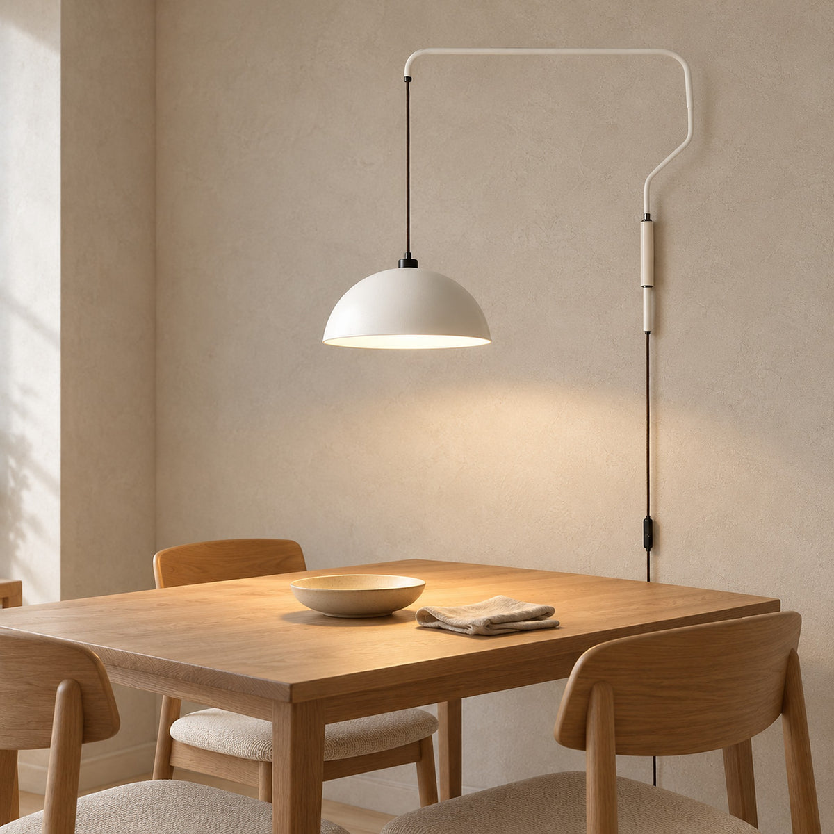 Velisano white wall lamp switched on and lighting a breakfast nook by day #color_white