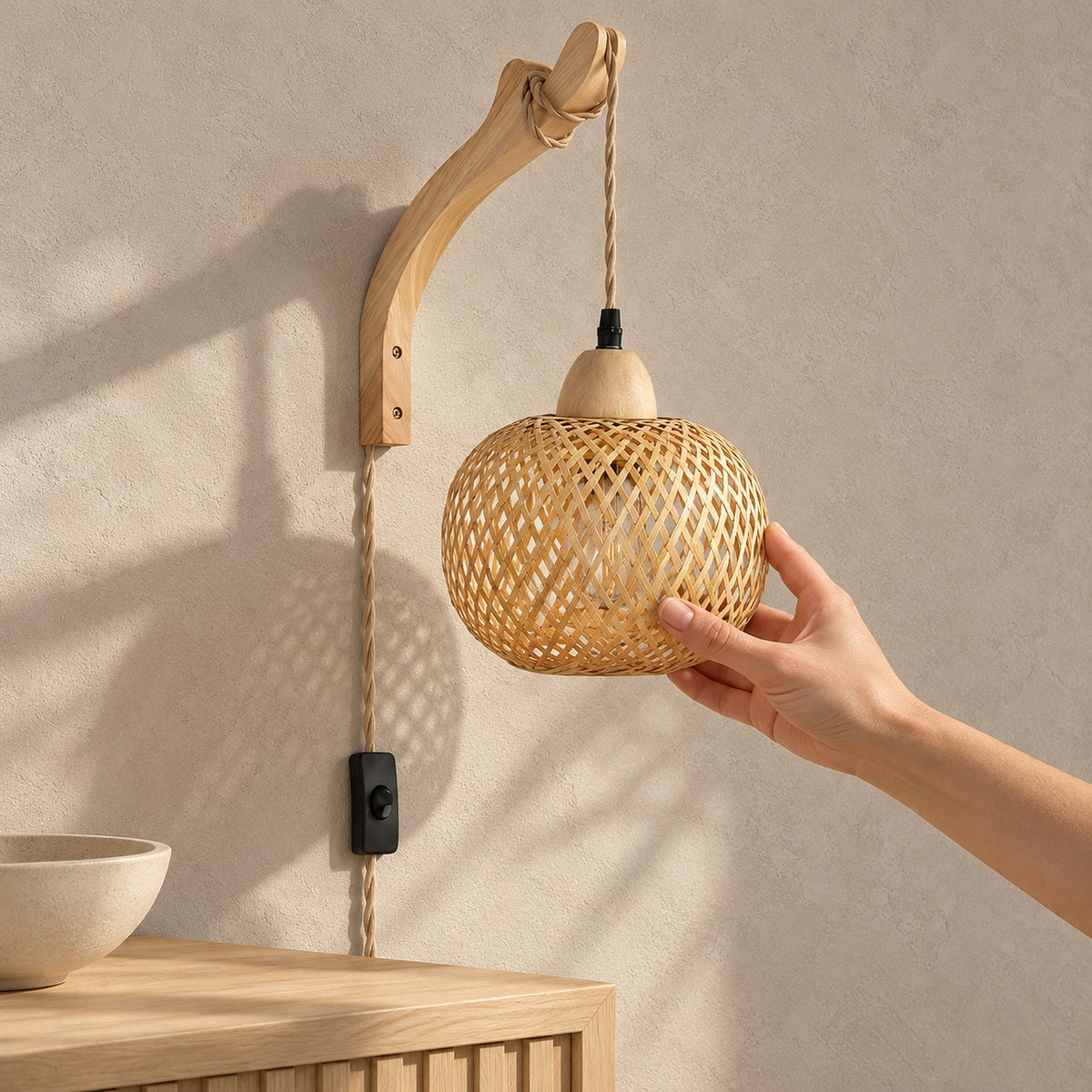 Vemira wood wall lamp with woven bamboo shade, unlit above a sunlit hallway console