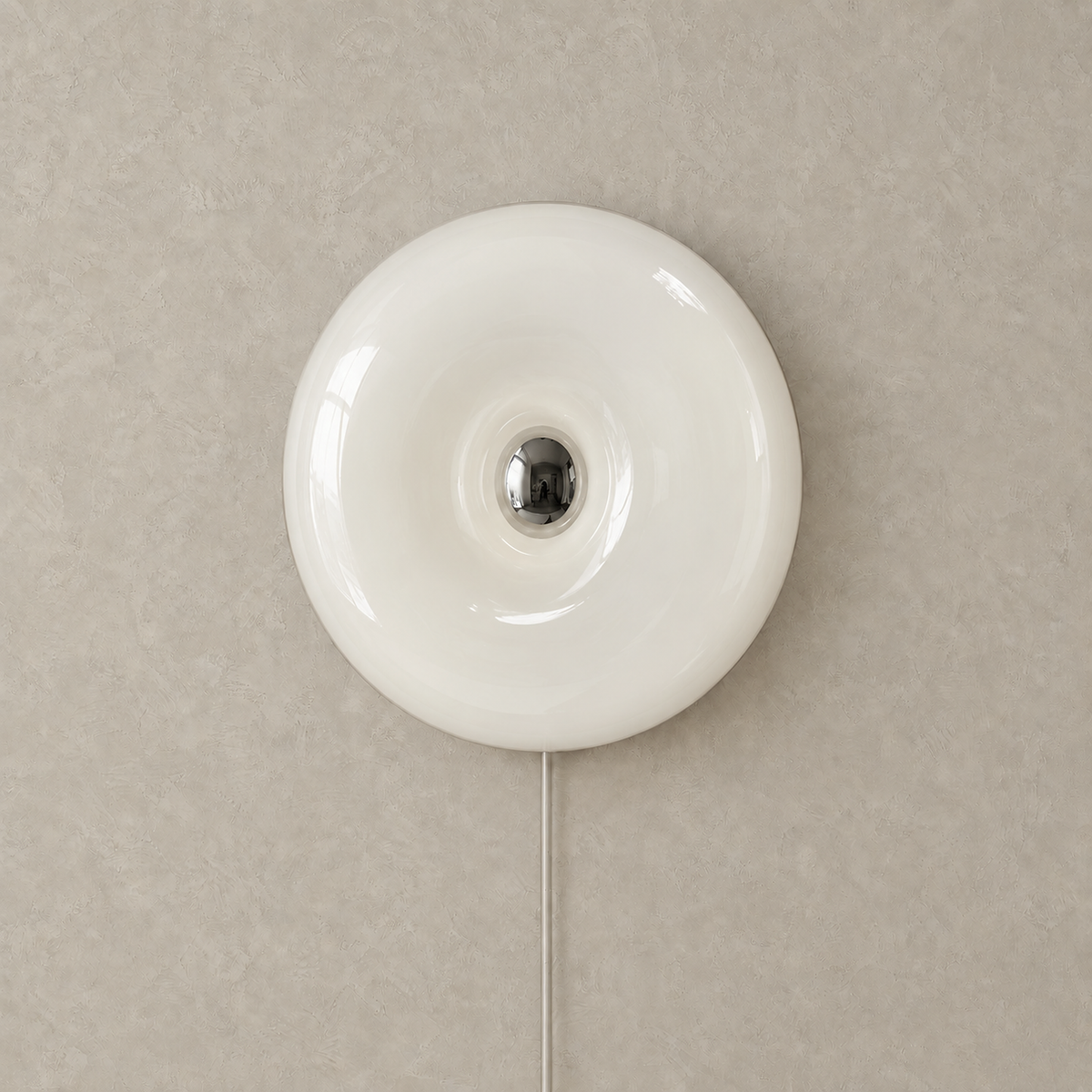 Vilomer white bedside wall light, unlit glass ring mounted on greige plaster wall #color_white