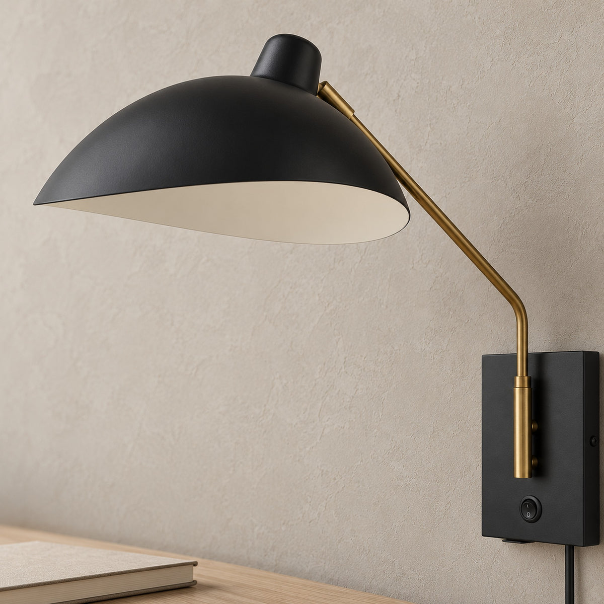 Vimolen black wall lamp close up of the dome shade, its pale interior and the adjustable joint