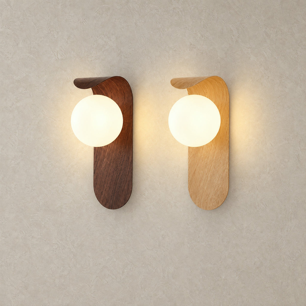 Arcelmo walnut and light wood wall sconce finishes lit warm white side by side