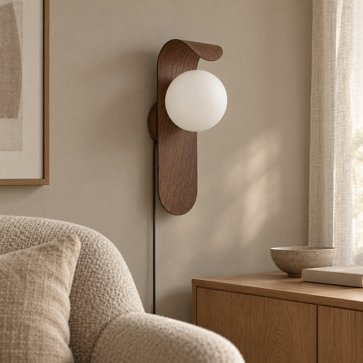 Arcelmo walnut plug in led wall sconce with its power cord running down the wall