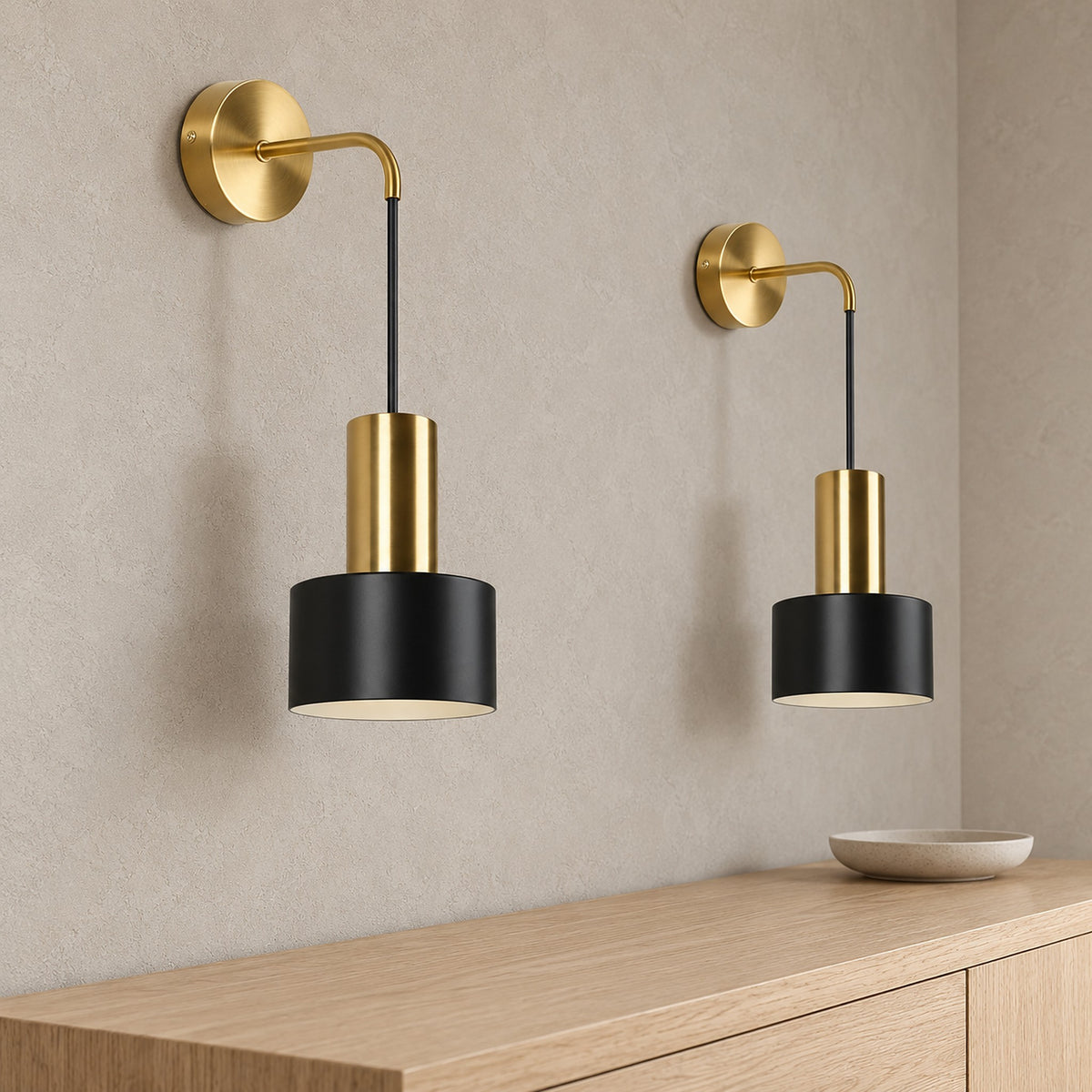Arsomel black and gold wall sconce close up of the shade and housing in an entryway nook