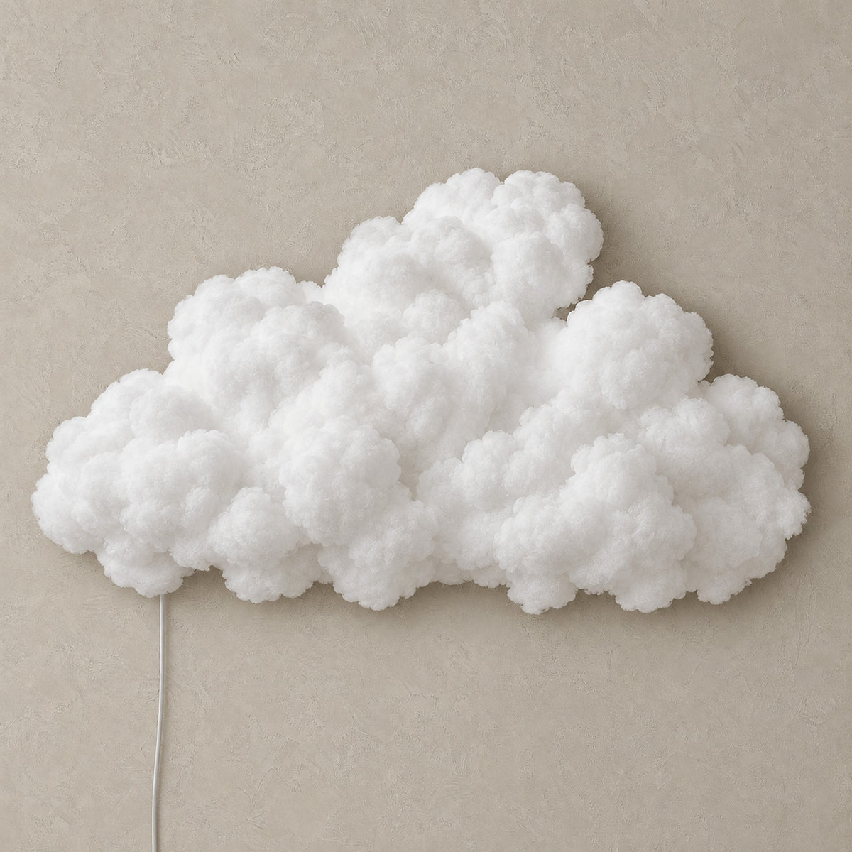 Arvimo LED cloud light in white, unlit against a greige plaster wall