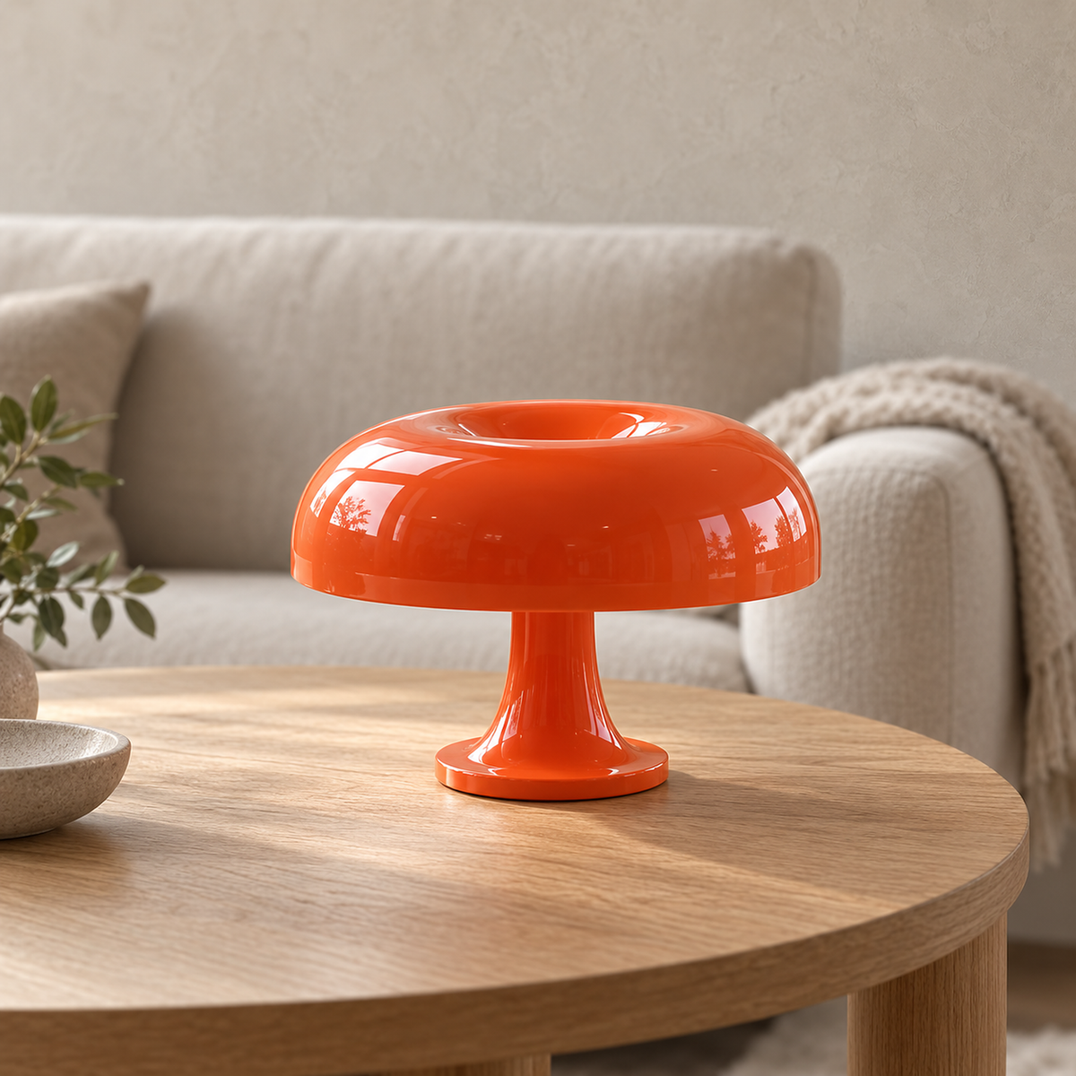 Camolire orange table lamp, close view of its glossy cap and shallow central dip in daylight