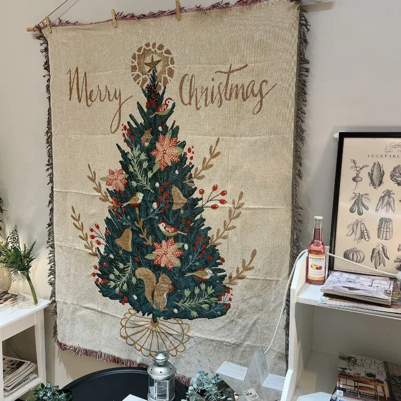Canelvi christmas jacquard throw blanket hangs on a wall, showing a Christmas tree and fringed edges.